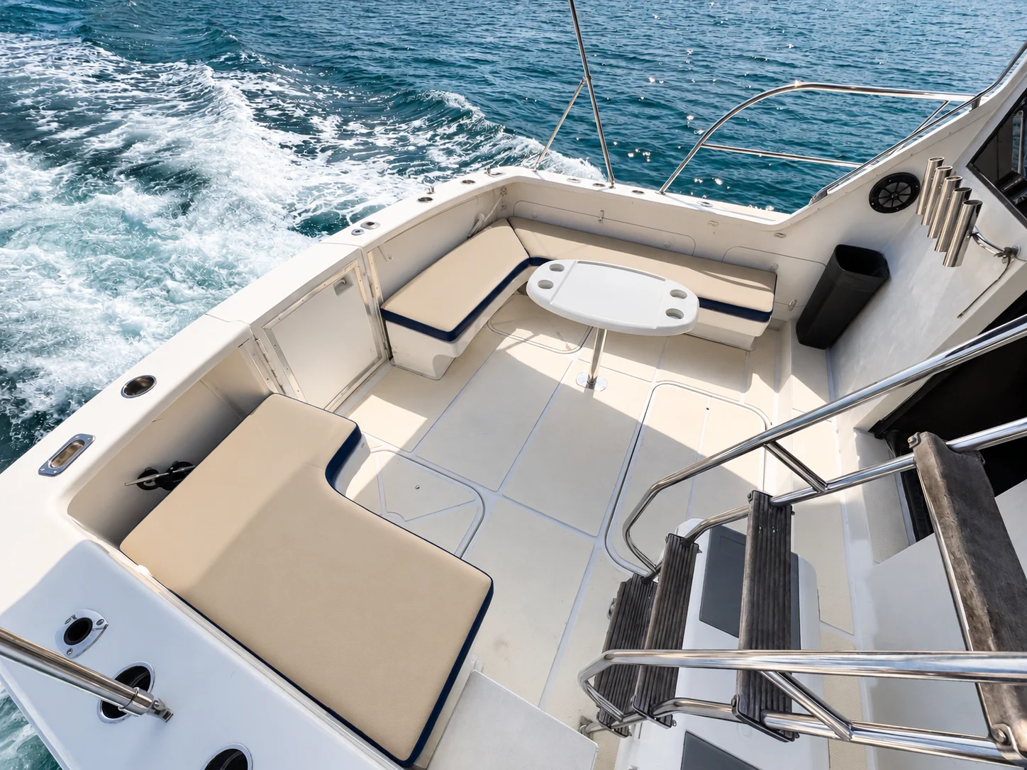 Open cockpit with cushioned seating and table aboard the Uniflite