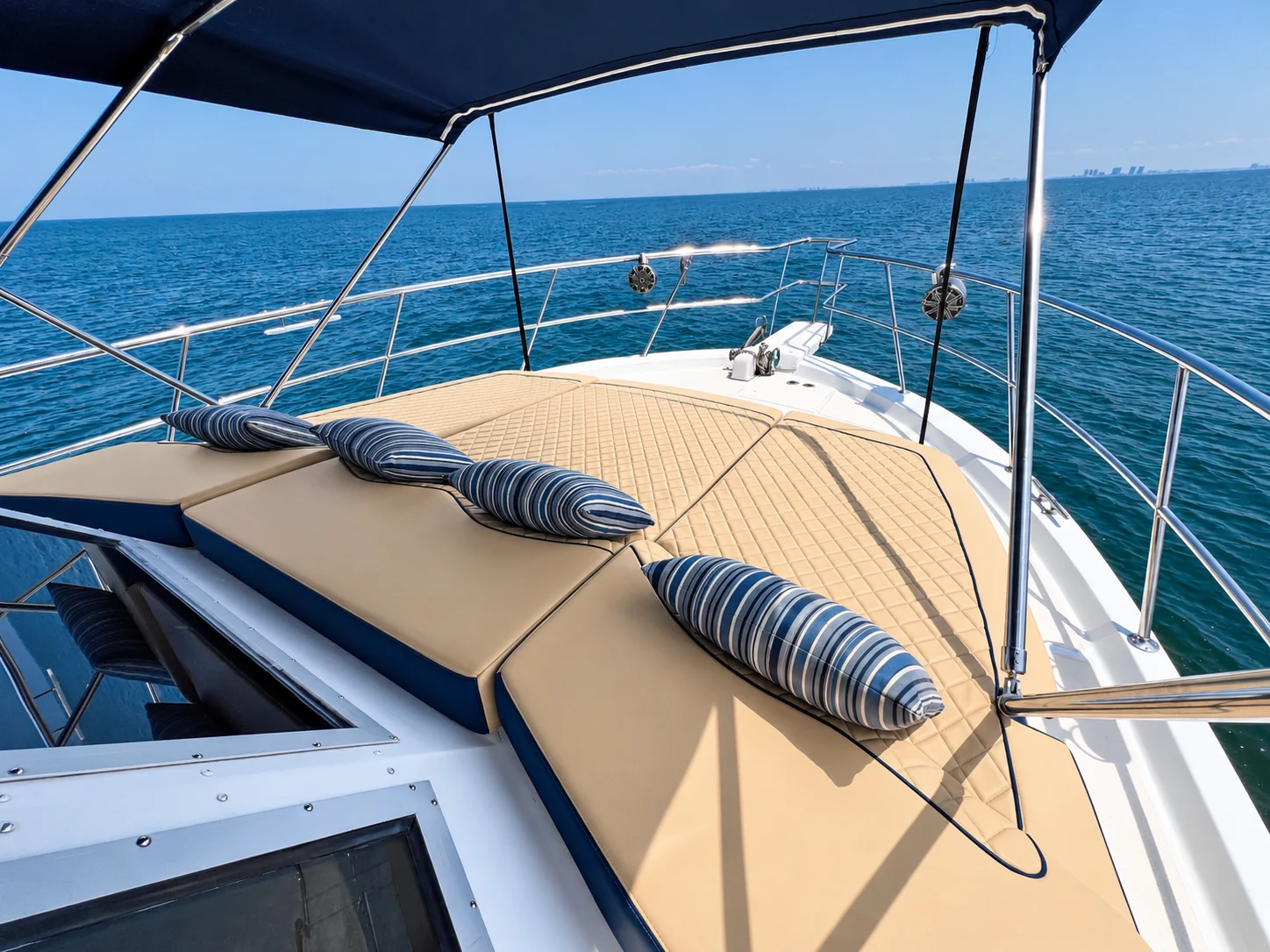 Cushioned sun lounge on the bow of the Uniflite