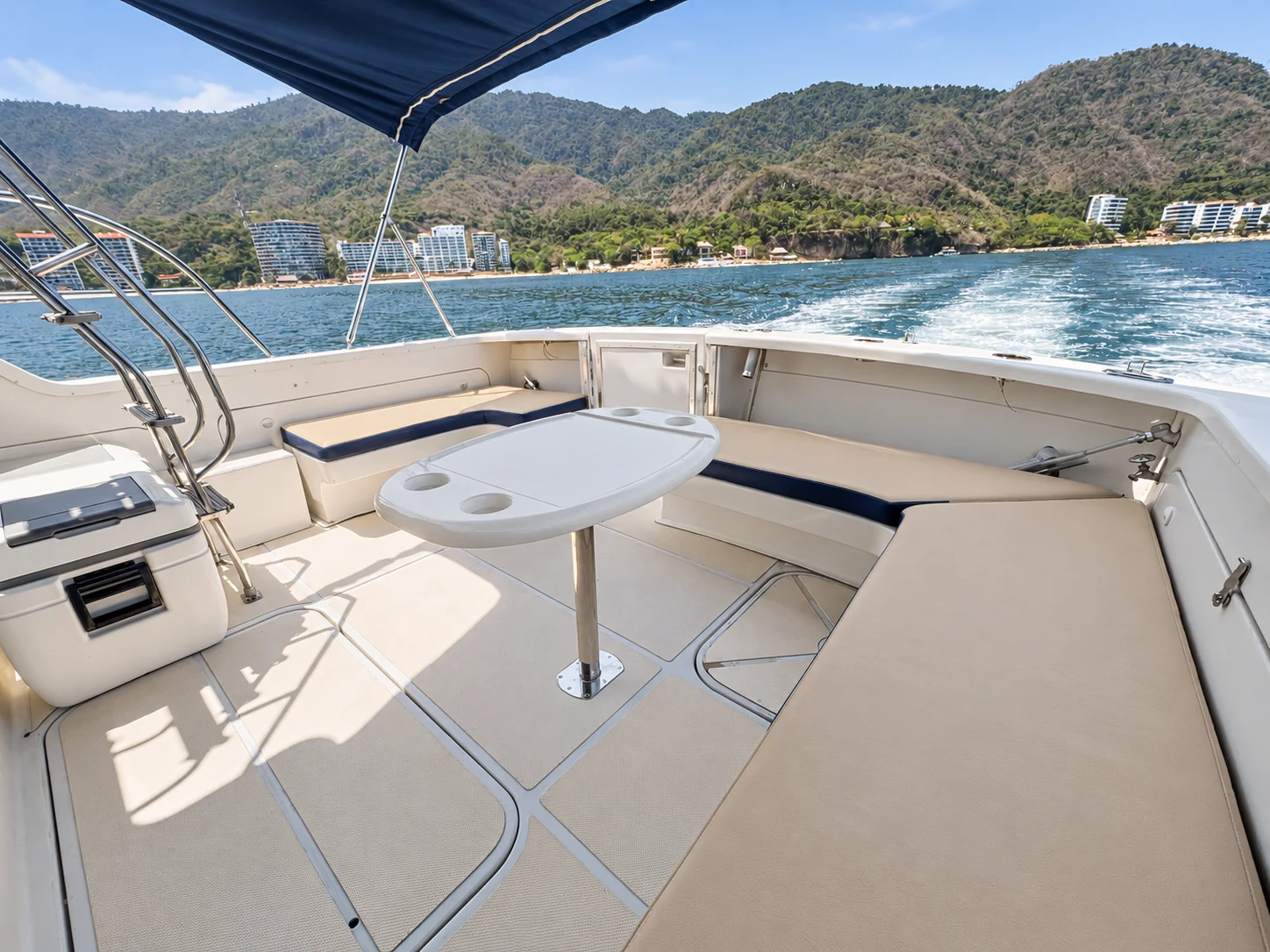 Shaded aft seating and table aboard the Uniflite